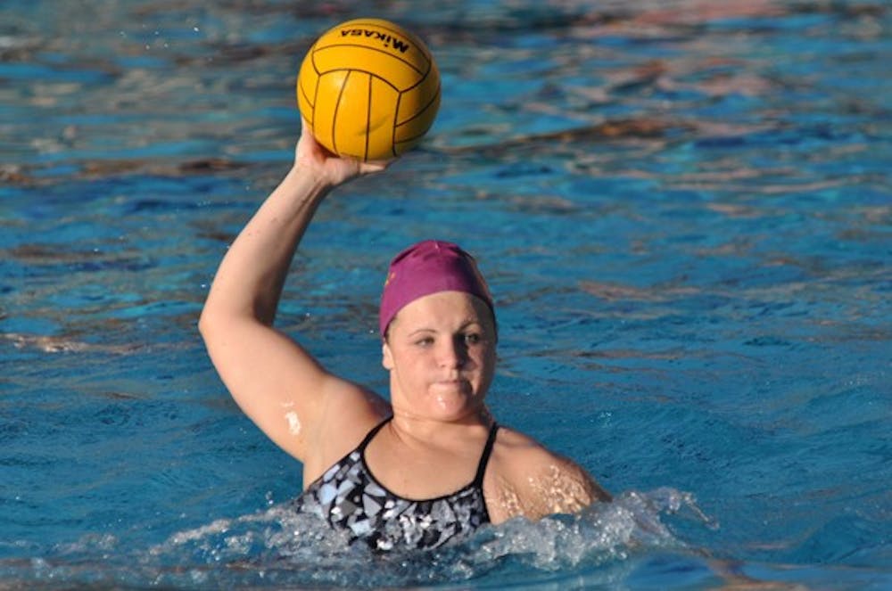 Tough Competition: ASU junior attacker Kelsey White passes the ball during practice on Feb. 24. The Sun Devils hope to earn their first conference win in more than two years against No. 3 UCLA on Saturday. (Photo by Sierra Smith)