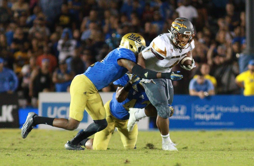 Sophomore running back Demario Richard (4) runs for a gain in the fourth quarter against UCLA on Saturday, Oct. 3, 2015, at Rose Bowl in Pasadena, California. The Sun Devils defeated the Bruins 38-23.