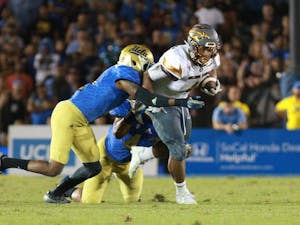 Sophomore running back Demario Richard (4) runs for a gain in the fourth quarter against UCLA on Saturday, Oct. 3, 2015, at Rose Bowl in Pasadena, California. The Sun Devils defeated the Bruins 38-23.