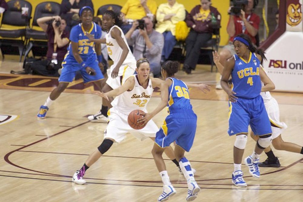 Second Half Struggles: ASU senior forward Becca Tobin guards the lane against UCLA junior guard Rebekah Gardner during the Sun Devils’ 61-45 loss on Saturday. The game was close at halftime, but the No. 11 Bruins blew away ASU in the second half. (Photo by Scott Stuk)