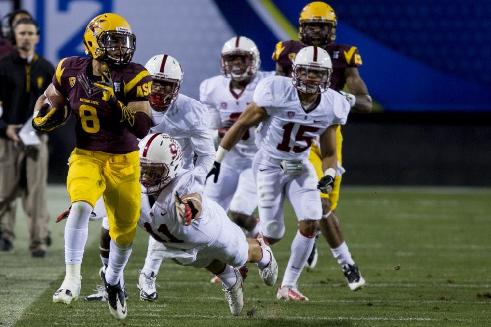 Junior running back D.J. Foster carries the ball up the field for an ASU touchdown in the Pac-12 Championship game against Stanford on Saturday, Dec. 7, 2013. (Photo by Dominic Valente)
