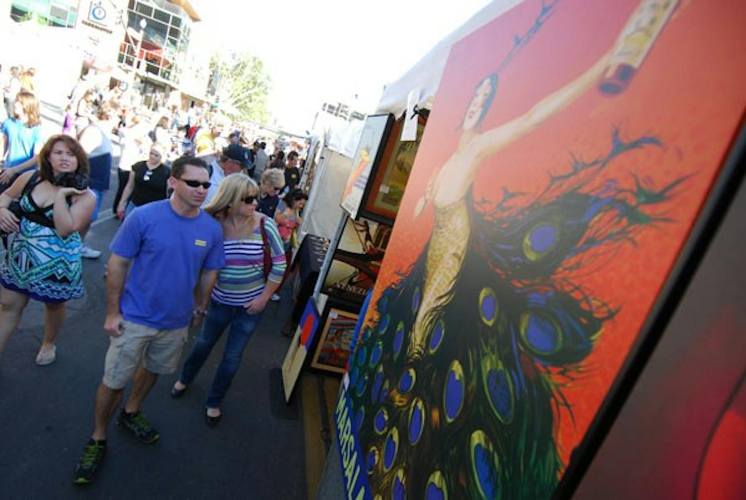 Voila Vintage of West Hills, Calif., showcased their art nouveau prints along with other classic paintings at the Tempe Festival of the Arts on Mill Avenue last weekend. (Photo by Murphy Bannerman)