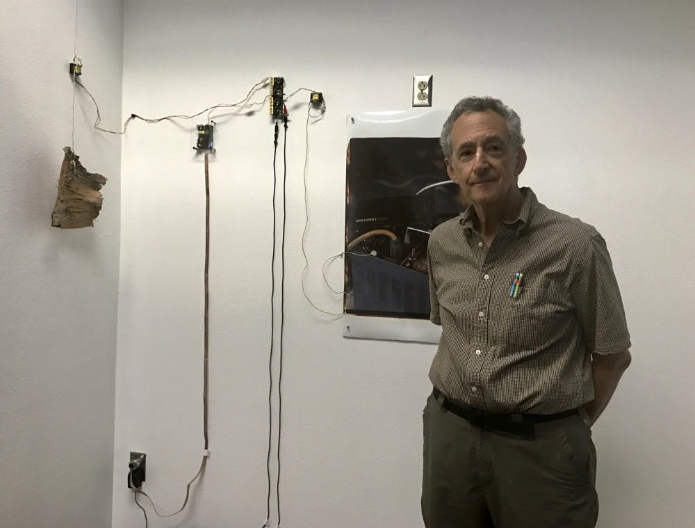 ASU Professor Richard Lerman by the 1987 display "Session: 20x24 Photographs"on Tuesday, March 21, 2017.