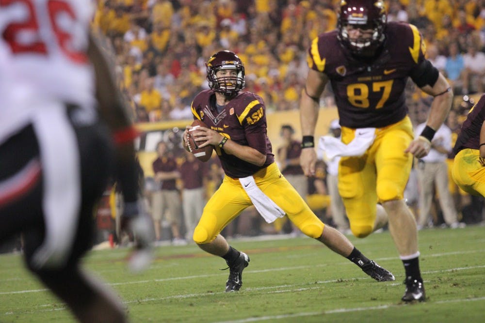 Redshirt junior quarterback Taylor Kelly takes a moment to contemplate the victory that the Sun Devils had over UCLA Saturday, Nov. 23. The Sun Devils face their rivals, the Wildcats, on Saturday. (Photo by Dominic Valente)