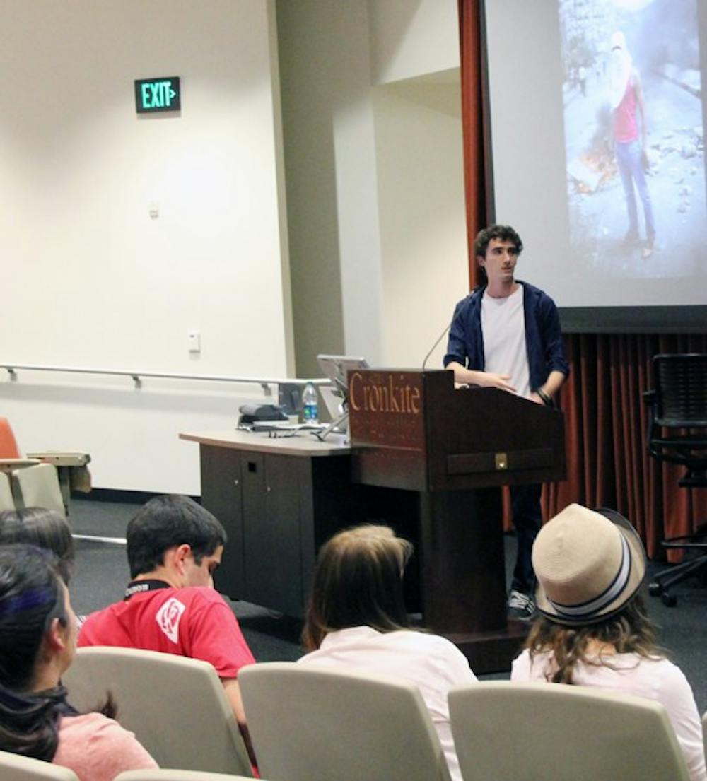 Italian photojournalist Ruben Salvadori speaks to students about the effects of the presence of photographers in situations at the Downtown campus Monday night. (Photo by Diana Lustig)