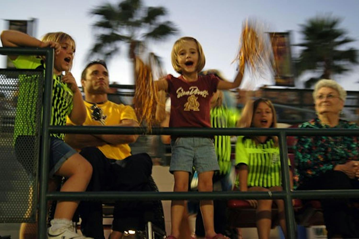 ASU fans cheer after the second winning goal from the Sun Devil women's soccer team on Nov. 2 in Tempe. The women's soccer team, which hosted their final game before playoffs, defeated rival University of Arizona 2-1. (Photo by Julie Vitkovskaya)