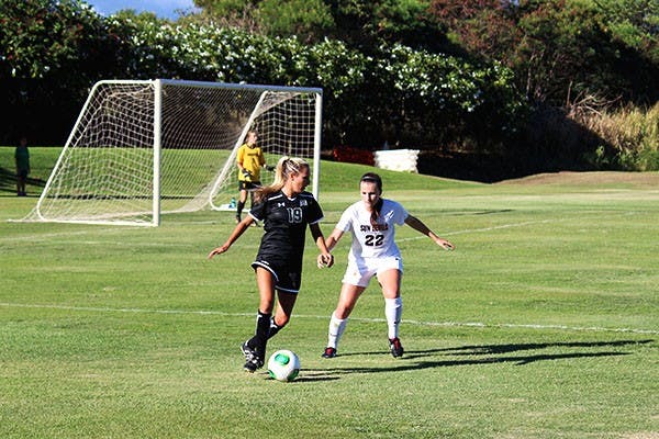 Freshman defender Madison Stark challenges a Hawaii player in a game in Hawaii. (Photo Courtesy of Nick Huth/Ka Leo O Hawaii)