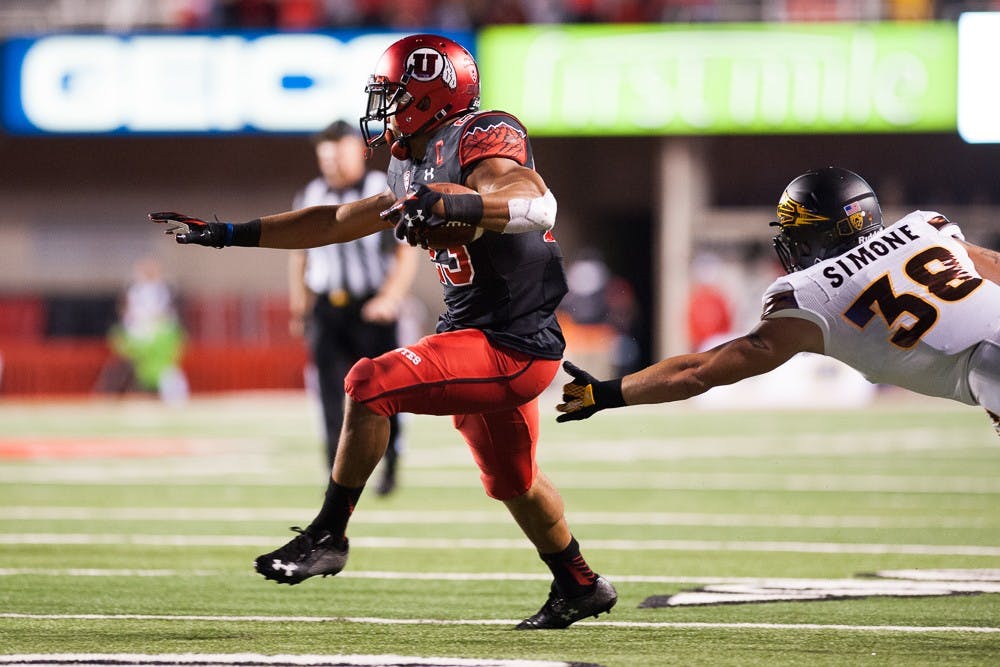 Utah senior wide receiver Devontae Booker runs with a pass against ASU on Saturday, Oct. 17, 2015, at Rice-Eccles Stadium in Salt Lake City, Utah.