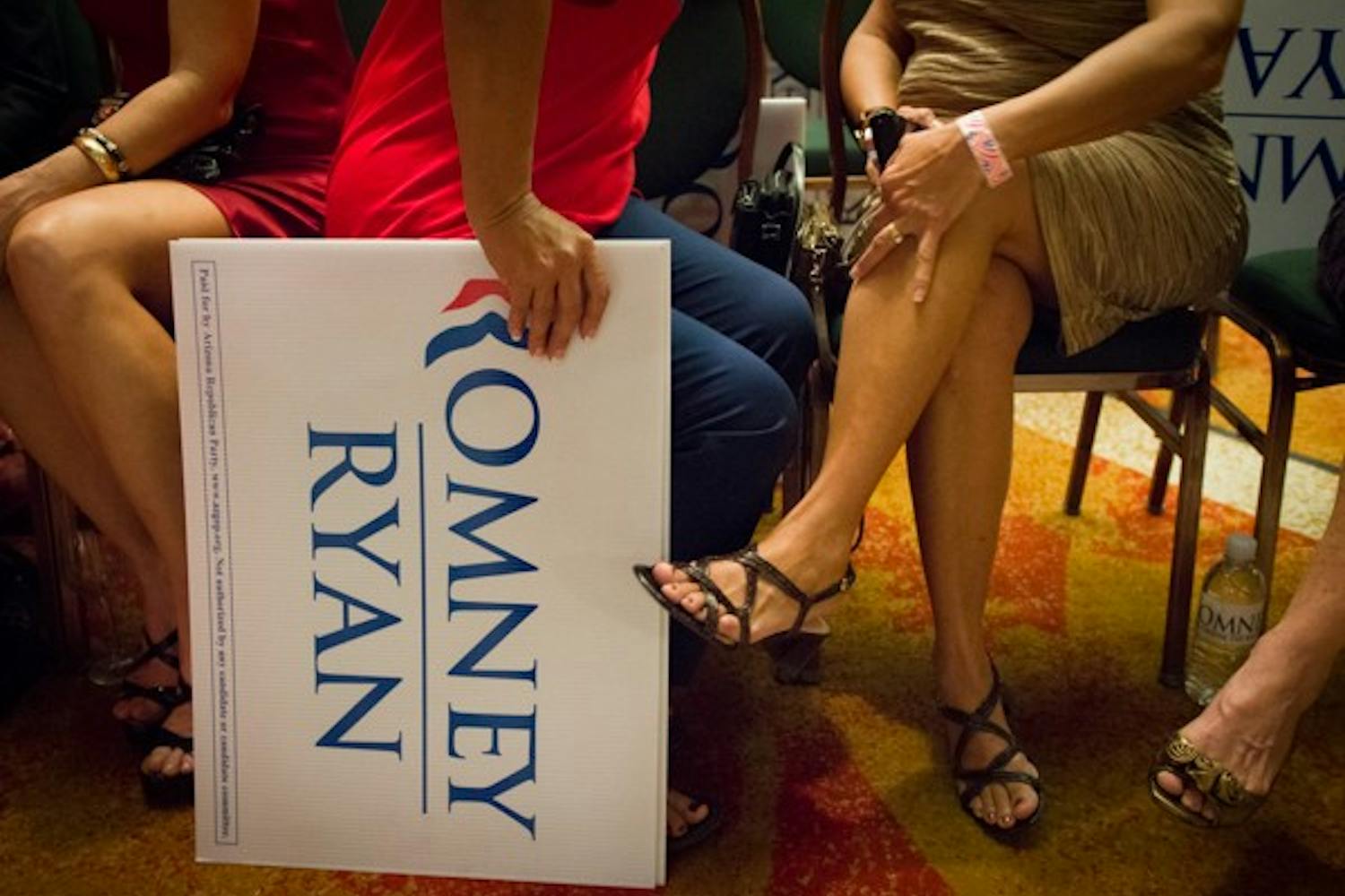 A Romney supporter holds a Romney-Ryan sign to the ground shortly after Obama's reelection was announced on Fox News.