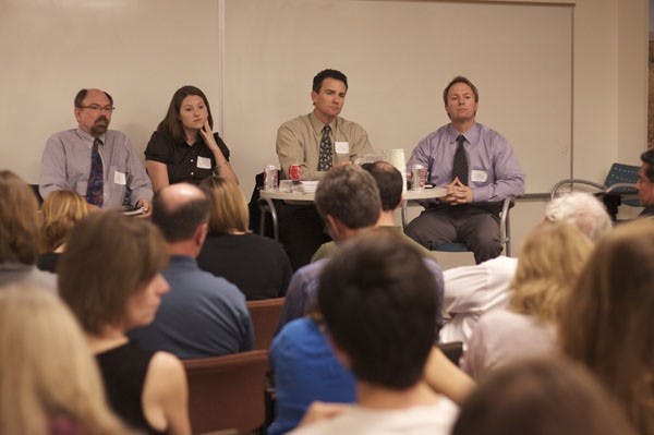 WATER REUSE: Panelists (from the left) Chuck Graf, Channah Rock, Guy Carpenter and Chris Hassert listen to a concerned Tempe resident as they discussed sustainable water reuse in Arizona on Wednesday afternoon. (Photo by Scott Stuk)