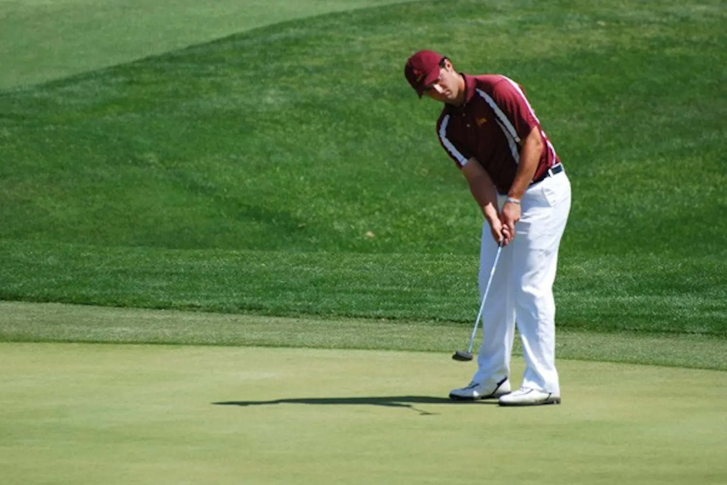 Junior Jon Rahm Rodriguez watches to see if his putt will find the whole during the ASU Thunderbird Invitational on April 7, 2013. Rahm is preparing to participate in the Phoenix Open (Photo by Murphy Bannerman)