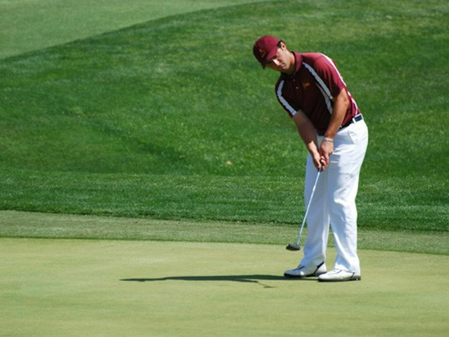 Junior Jon Rahm Rodriguez watches to see if his putt will find the whole during the ASU Thunderbird Invitational on April 7, 2013. Rahm is preparing to participate in the Phoenix Open (Photo by Murphy Bannerman)