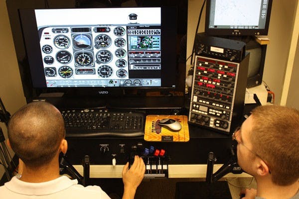 FLYING HIGH: The latest flight simulators, developed by the Air Force Research Laboratory, allows pilots to become better accustomed and better prepared for flight in a real cockpit.  (Photo by Jessica Weisel)