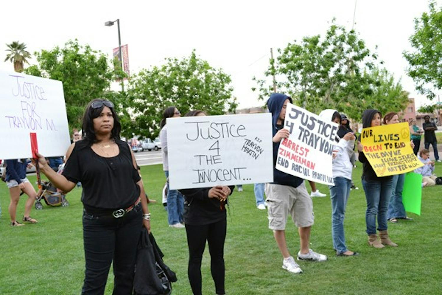 Hundreds of people wearing black hoodies gathered in Civil Space Park to march for justice for Trayvon Martin Sunday evening. (Photo by Mackenzie McCreary)