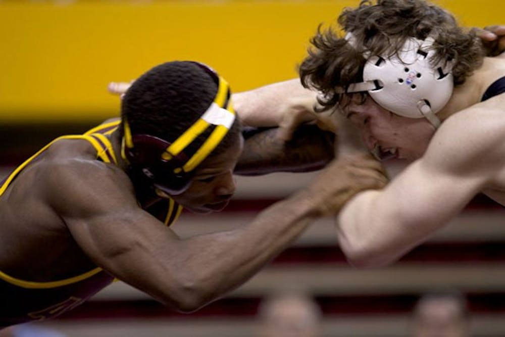 On Jan. 27 ASU’s Sun Devils played Oklahoma State’s Cowboys at the Wells Fargo Arena in Tempe. ASU sophomore Joel Smith played against Oklahoma State’s freshman Alex Dieringer. (Photo by Ana Ramirez)