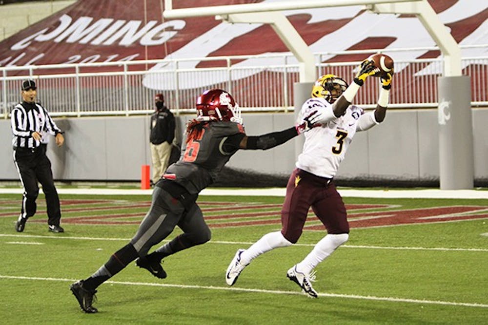 Sophomore wide receiver Richard Smith scores a 51 yard touchdown against WSU at Martin Stadium, Thursday, Oct. 31. (Photo by John Freitag, Daily Evergreen)