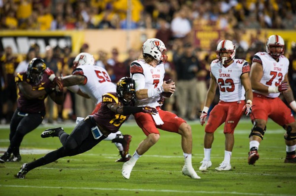 Freshman defensive back Armand Perry hits Utah quarterback Travis Wilson during ASU's 19-16 overtime win. (Photo by Andrew Ybanez)