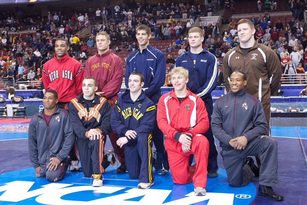 National Champions: ASU seniors Anthony Robles (bottom left) and Bubba Jenkins (bottom right) pose with the other eight NCAA title winners on Saturday. (Photo courtesy of Wesley Herrera )