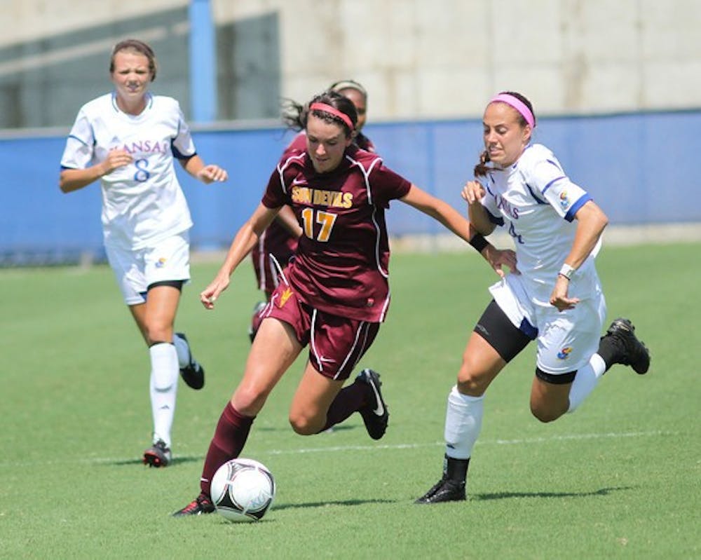 Freshman forward Cali Farquharson dribbles past Kansas defenders in the Sun Devils’ 2-2 draw to the Jayhawks on Sunday. (PHOTO COURTSEY OF STEVE RODRIGUEZ)