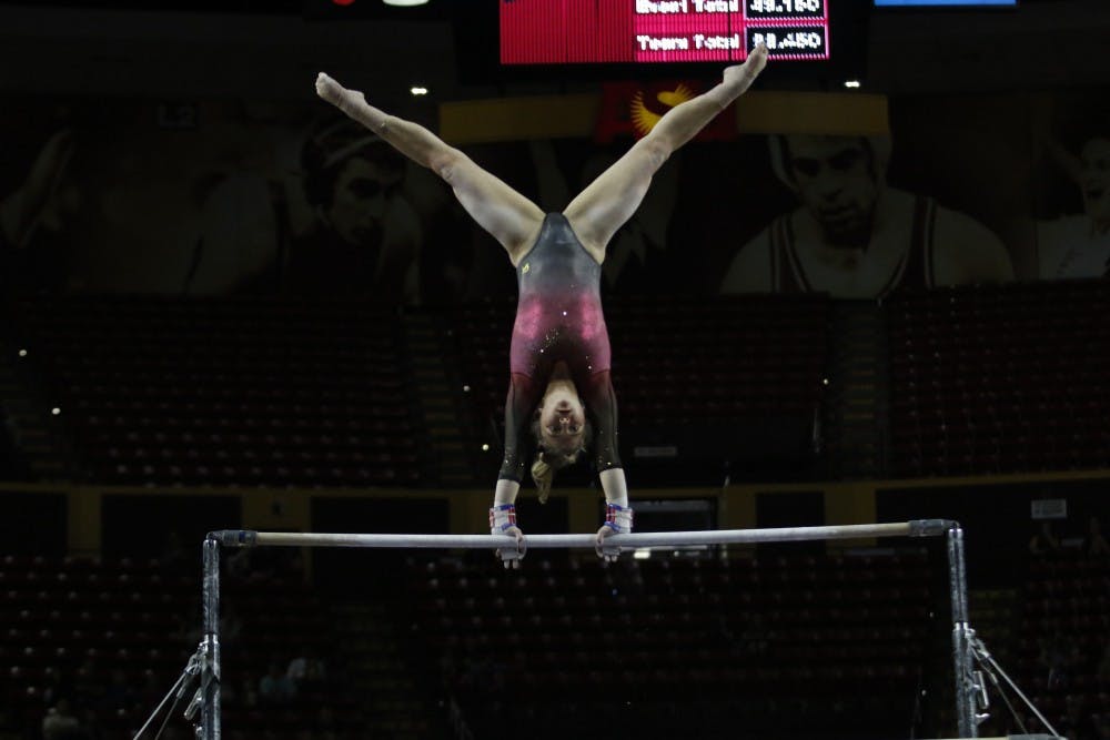 ASU junior Nichelle Christopherson performs on the bars in a gymnastics meet against UCLA at Wells Fargo Arena in Tempe, Ariz. on Saturday Feb. 4, 2017.  