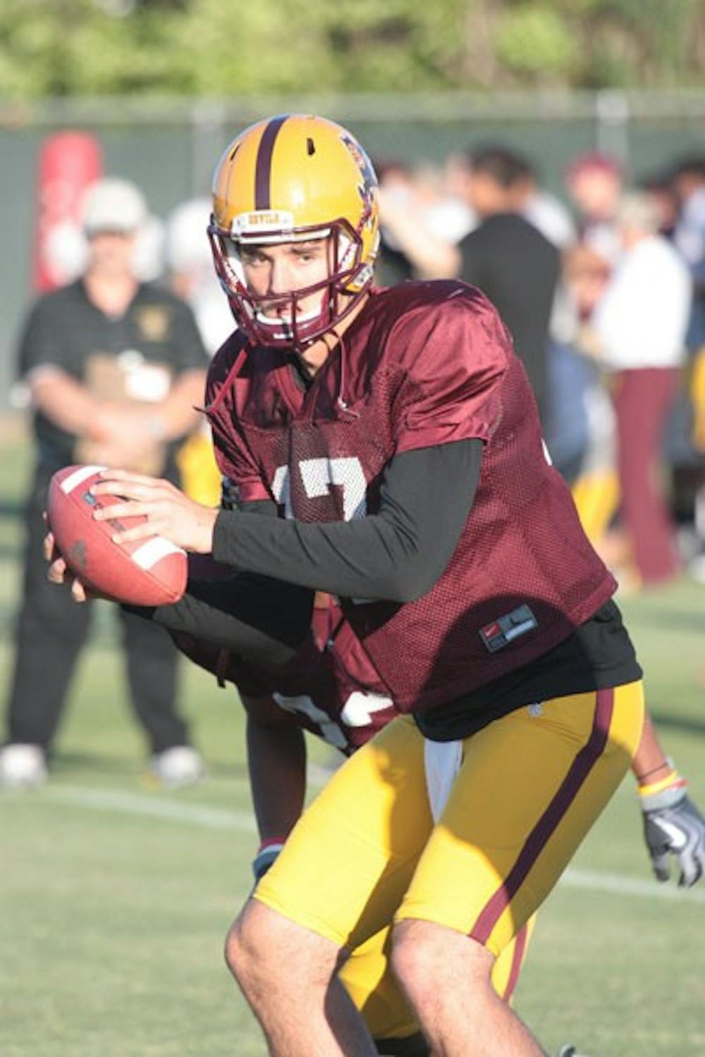 GETTING OFFENSIVE: ASU sophomore quarterback Brock Osweiler begins to drop back to pass during a spring practice last week. (Photo by Nick Kosmider)