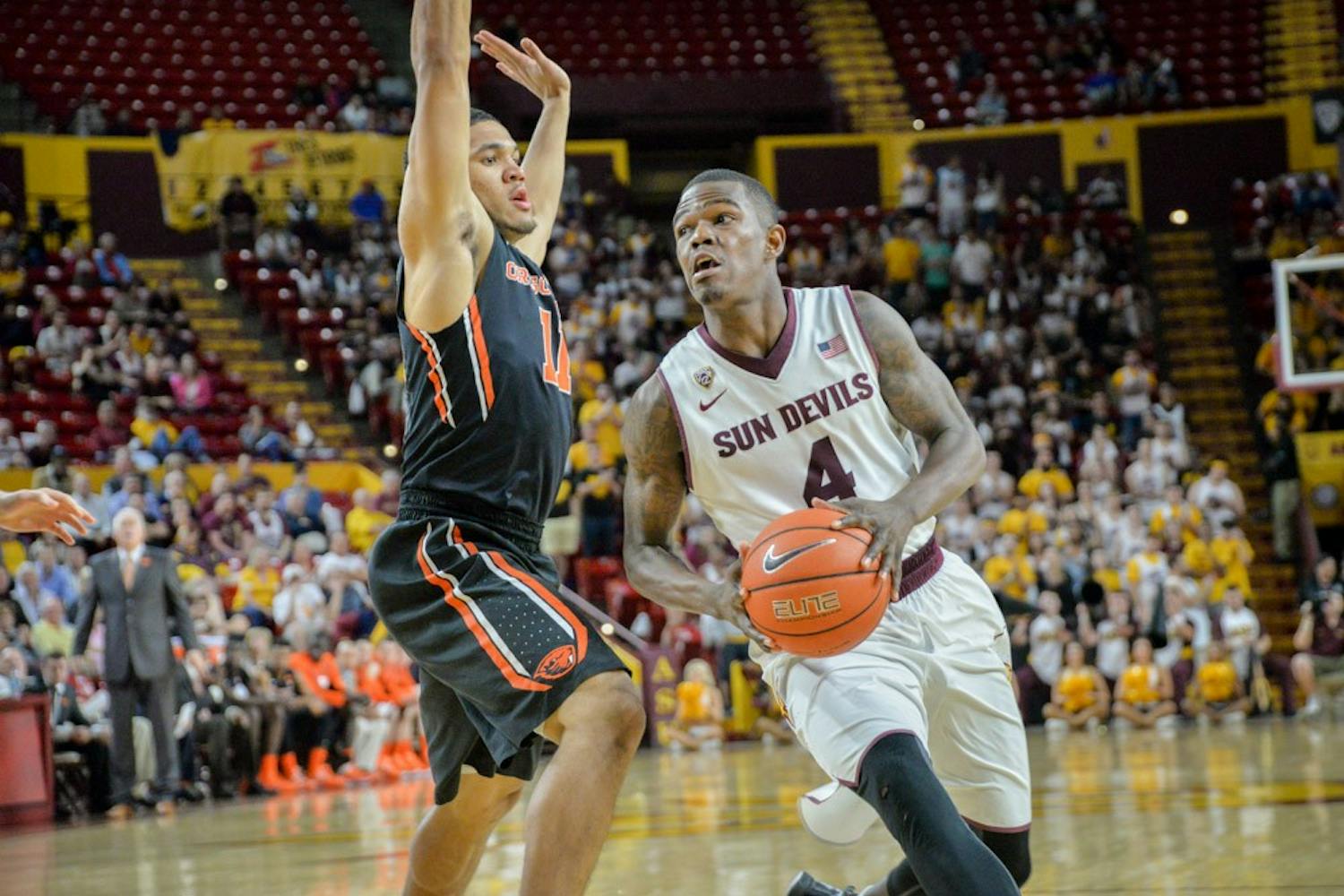 Guard Gerry Blakes (4) moves past the OSU defense on Wednesday, Jan. 28, 2015 at Wells Fargo Arena in Tempe.
