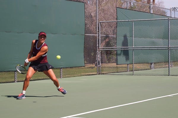 Sophomore Gussie O'Sullivan returns a forehand during her first match against Saint Mary's freshman Emma Critser on March 7, 2015, at the Whiteman Tennis Center in Tempe. (Kaitlyn Ahrbeck/The State Press)