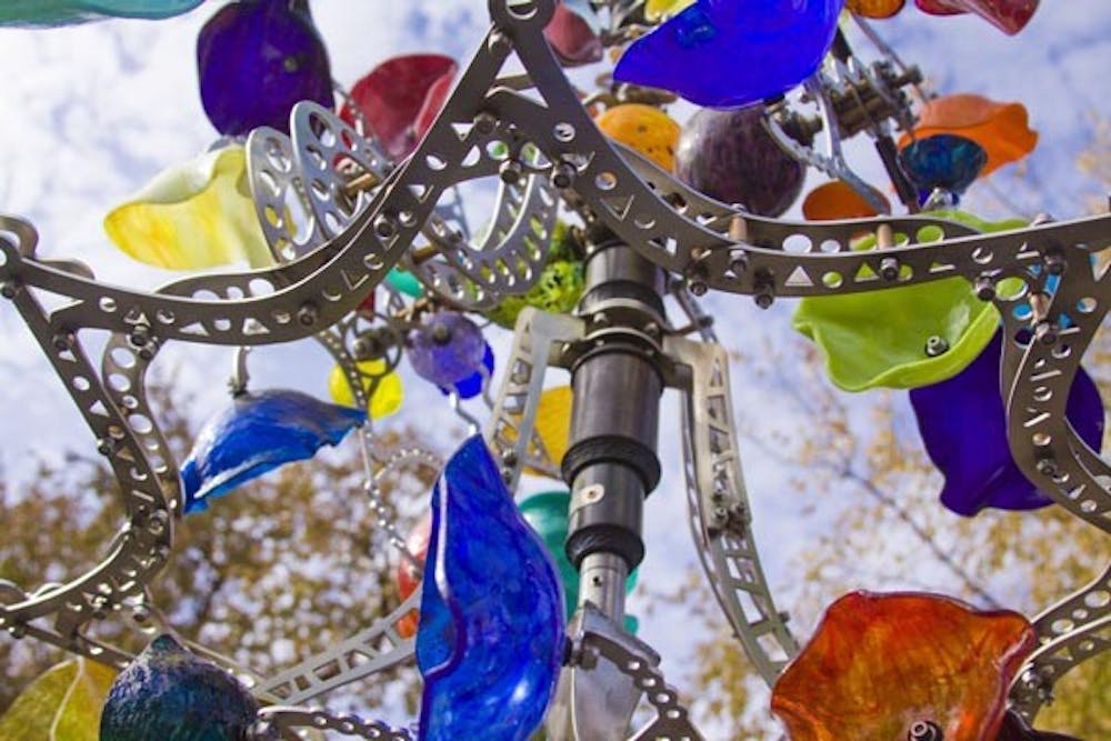 UNIQUE ART: A glass chandelier with many different colored glasses hangs for sale at one of the 400 vendors at Tempe’s 42nd Annual Fall Art Festival. The Tempe Festival of the Arts ranks among the Top 20 art festivals in the nation. (Photo by Annie Wechter)