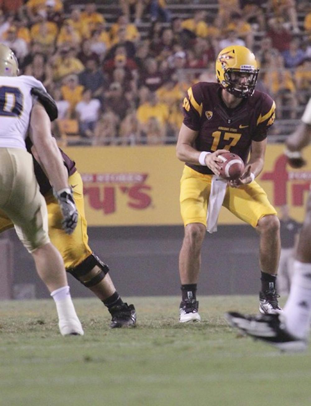 READY TO ROLL: ASU junior quarterback Brock Osweiler takes a snap during the Sun Devils’ win over UC Davis on Thursday. Osweiler said he’s excited for the opportunity to face a ranked opponent in Missouri. (Photo by Beth Easterbrook)