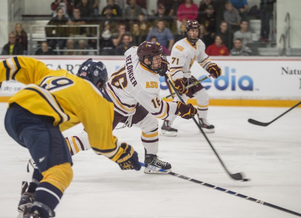 Right wing Ryan Belonger, center, takes a shot at the goal in the second period of a game at the Oceanside Ice Arena in Tempe, Ariz. The Sun Devils led Southern New Hampshire 7-1 after the second period. 