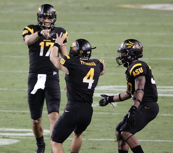 MAKING CONNECTIONS: Senior wide receiver Aaron Pflugrad (4) celebrates with junior quarterback Brock Osweiler (17) and junior wide receiver Jamal Miles (32) during the Sun Devils 37-30 overtime win over Missouri. Osweiler looks to keep all of his receivers involved when ASU hosts Colorado on Saturday. (Photo by Beth Easterbrook)