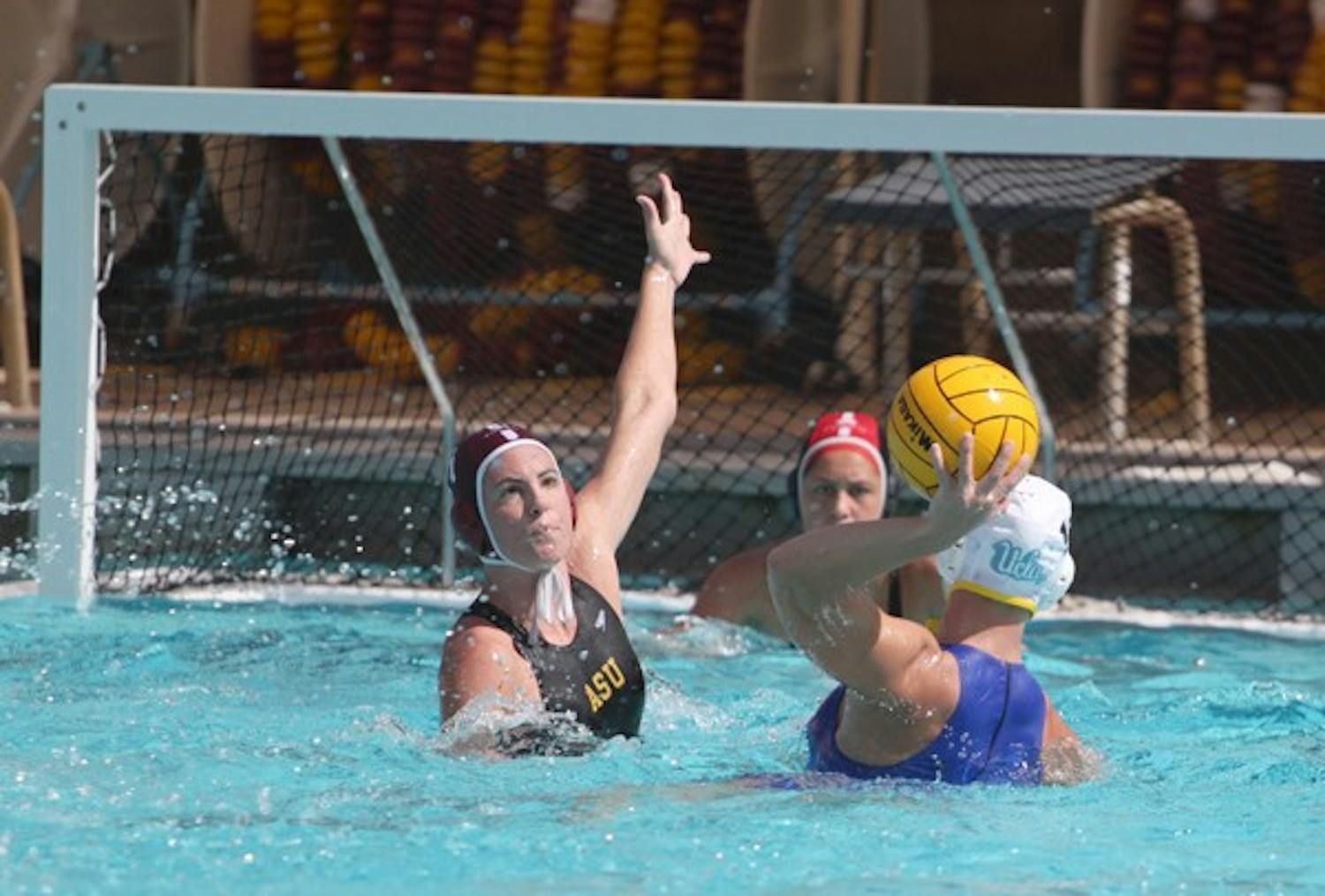 Still searching: ASU redshirt senior attacker Sarah Harris reaches to block a shot during the Sun Devils’ 8-1 loss to UCLA on March 5. After dropping Saturday’s game to Hawaii, ASU closed out the regular season without a victory in conference play. (Photo by Beth Easterbrook)