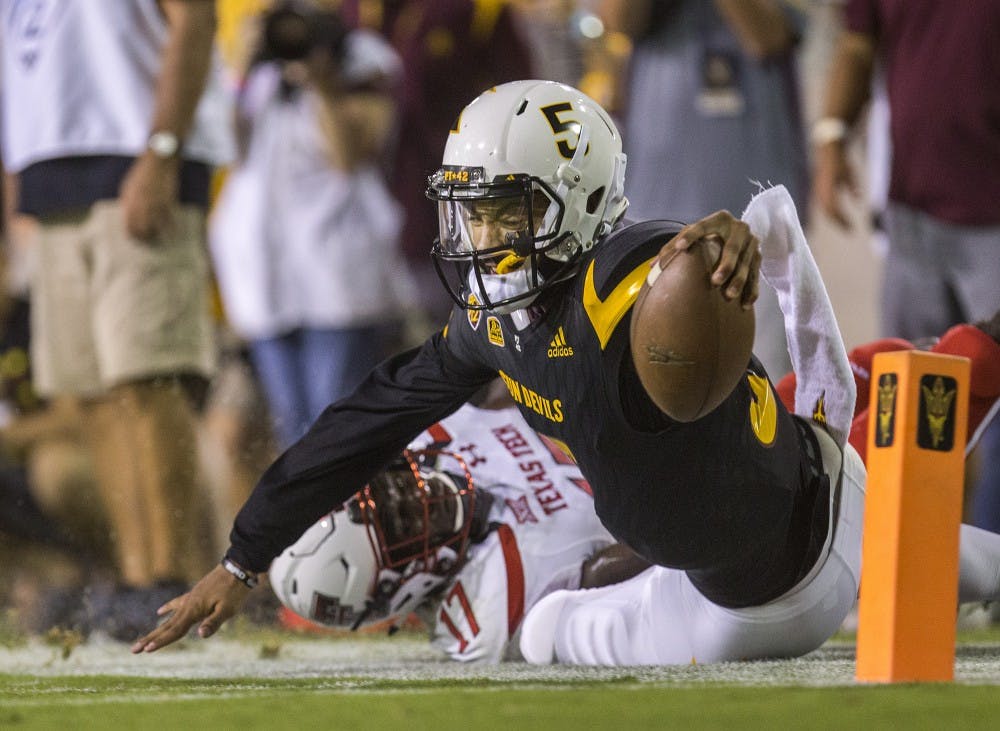 ASU redshirt senior quarterback Manny Wilkins dives towards the end zone during a game against the Texas Tech Raiders in Sun Devil Stadium on Saturday, Sept. 10, 2016. 