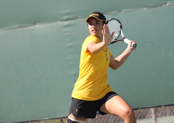Freshman Desirae Krawczyk leans into to a swing at a ASU tennis practice. The team looks to sweep NAU and UC Davis this weekend after not competing in over a month. (Photo by Kyle Newman)