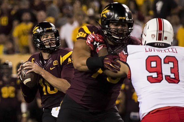 Redshirt senior quarterback Taylor Kelly looks down field for an open receiver in a home game against Utah on on Nov. 1, 2014. ASU defeated Utah in overtime 19-16. (Photo by Alexis Macklin)