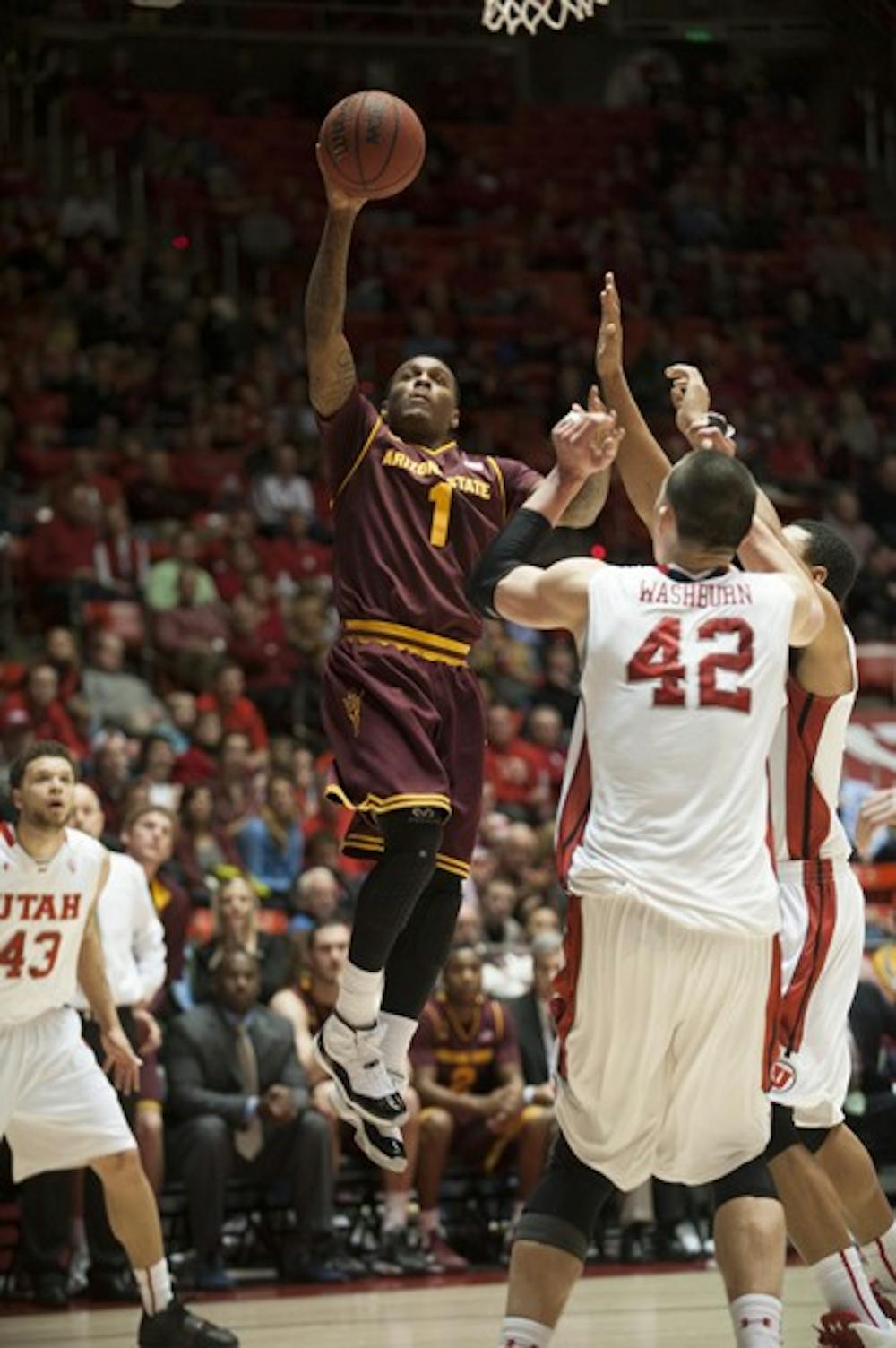 Redshirt freshman Jahii Carson lets go of a floater against Utah on Feb. 13. The ASU basketball team's loss to the Utes hurts the team's chances of getting into the tournament. (Photo Courtesy of The Daily Utah Chronicle)