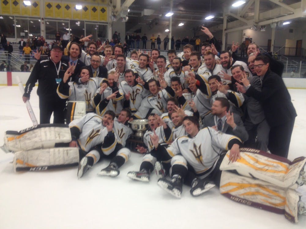 The ASU hockey team celebrates after winning its first national title at Fred Rust Ice Arena in Newark, Del. (Photo by Justin Emerson)