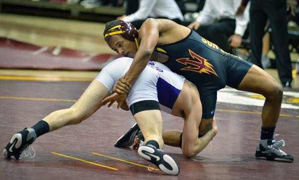 Redshirt freshman Hans Rasmusson attempts to contain GCU junior Bobby Ward during the Sun Devils’ meet with the ‘Lopes and Embry-Riddle on Nov. 13. The Sun Devils compete in one of their most pivotal tournaments of the season at the Cliff Keen Las Vegas Invitational on Friday and Saturday. (Photo by Aaron Lavinsky)