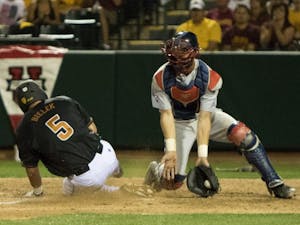 Senior Joey Bielek scores off a sacrifice fly by junior Johnny Sewald in the bottom of the fifth inning against University of Arizona at Phoenix Municipal Stadium Saturday, April 11, 2015. The Sun Devils defeated the Wildcats 5-4. 
