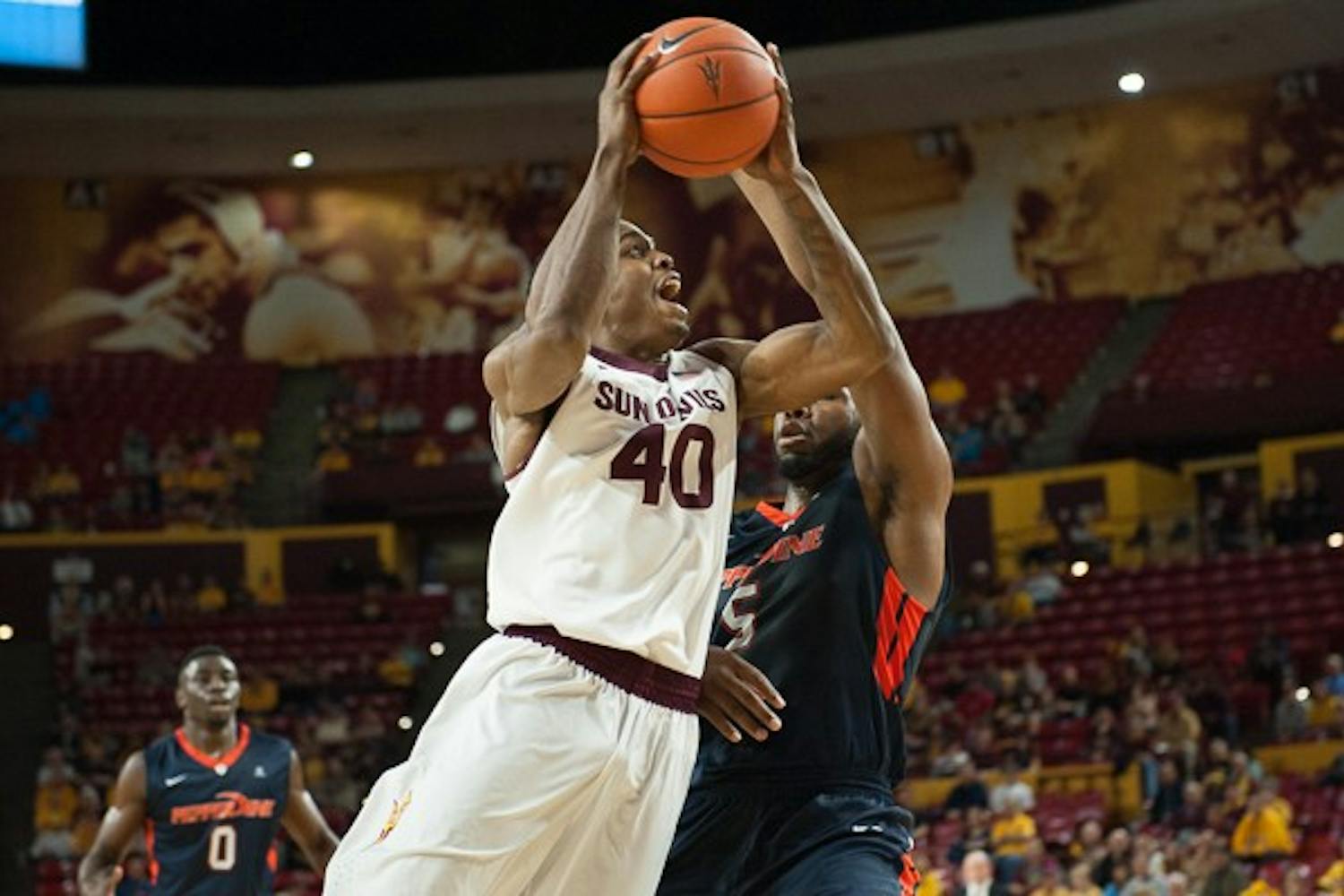 in a game against Pepperdine, Saturday, Dec. 13, 2014 at Wells Fargo Arena in Tempe. After trailing the entire first half, the Sun Devils came from behind and defeated the Waves 81-74. (Photo by Ben Moffat)