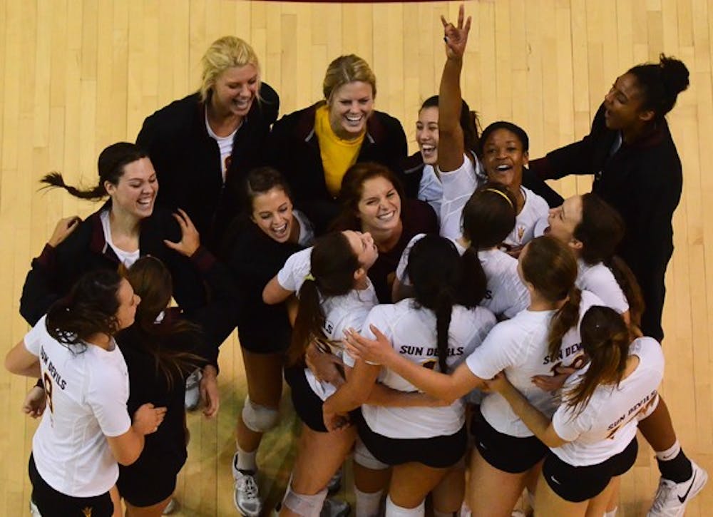 The ASU Volleyball Team celebrates after defeating the Wildcats 3-1 to win this year's Territorial Cup.