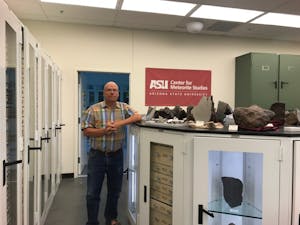 Laurence Garvie, researcher at ASU’s Center for Meteorite Studies, poses for a picture in the “meteorite vault” at ASU on Wednesday, April 19, 2017.&nbsp;