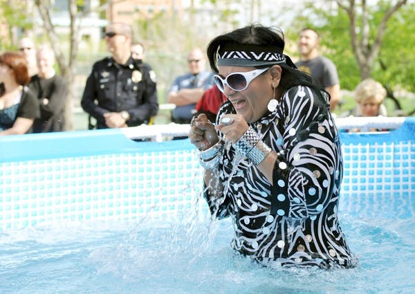 CHILL OUT: Ruth Sanchez, the director of the Arizona Law Enforcement Torch Run for Special Olympics, reacts after taking a leap into ice-cold water at the Tempe Polar Plunge on Saturday. (Photo by Sierra Smith)