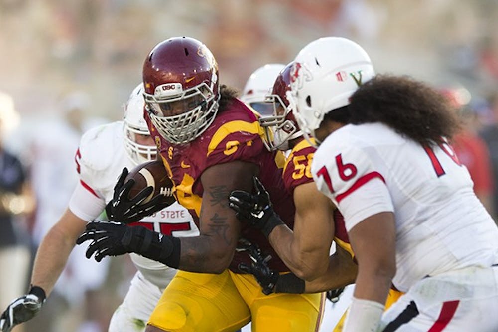 USC junior defensive end Leonard Williams runs with the ball. (Photo Courtesy of Ralf Cheung/The Daily Trojan)