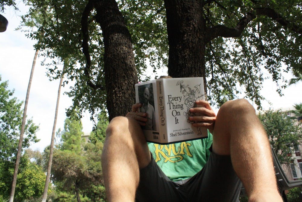 “Come, Boy, sit down. Sit down and rest./ And the boy did./ And the tree was happy.” (Silverstein, The Giving Tree) Fifth year architecture student Jordan Snittjer enjoys a Silverstein classic.
Photo by Noemi Gonzalez