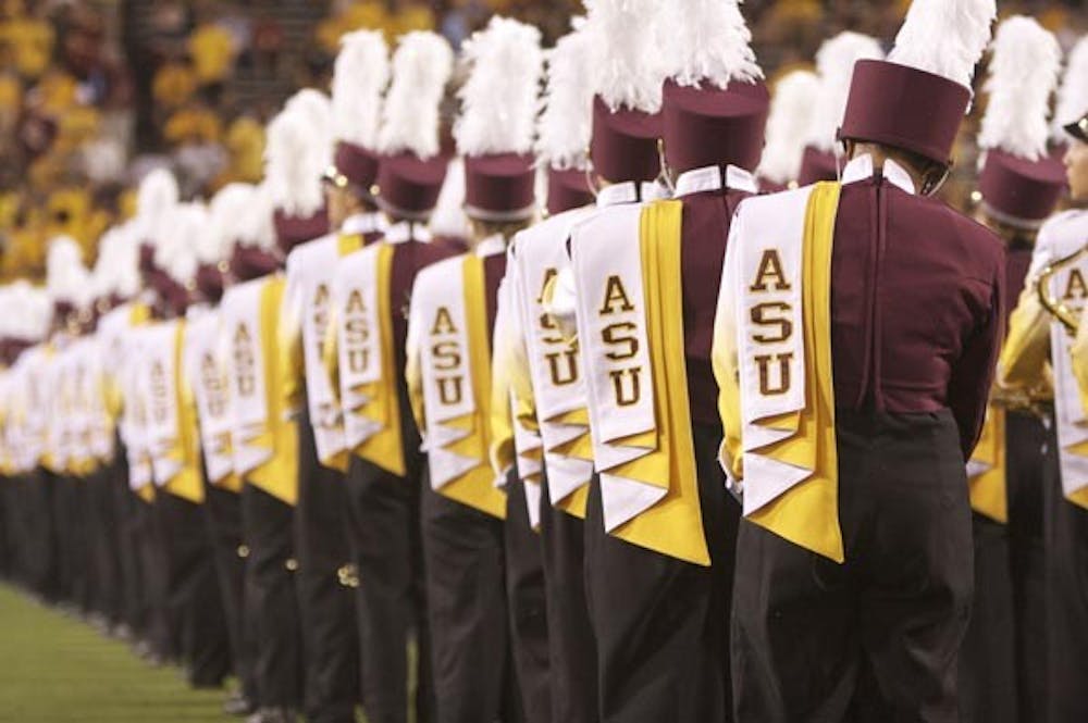 AWAITING THE ARRIVAL: The ASU marching band lines up just before the ASU football team takes the field Saturday night in the game against Norther Arizona University. (Photo by Scott Stuk)