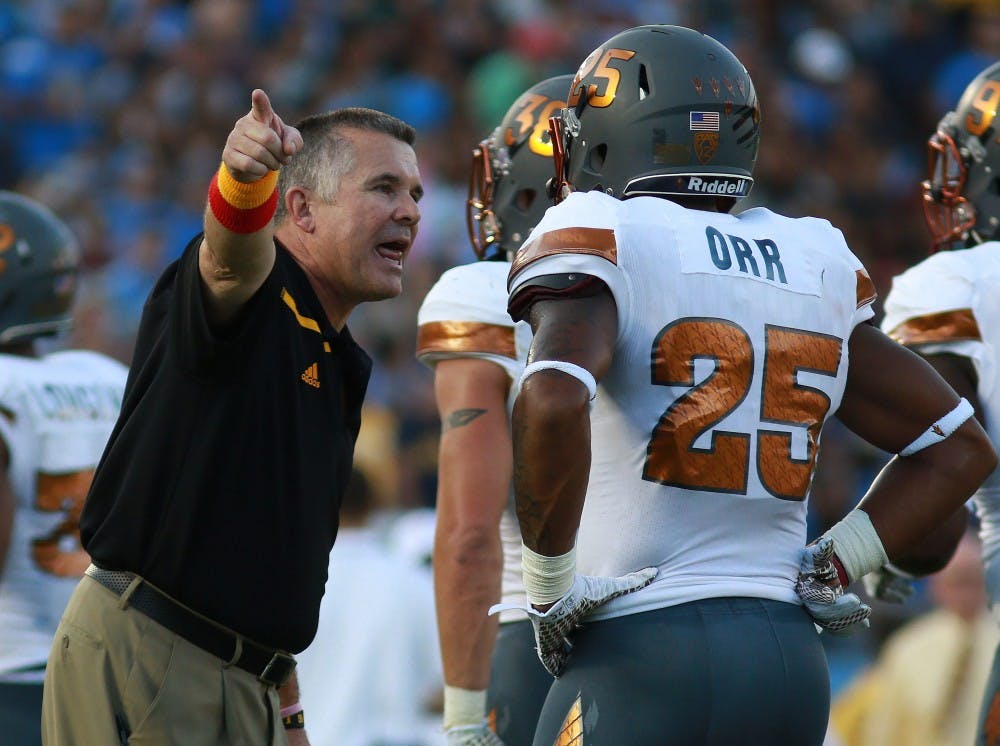 Head coach Todd Graham talks with Freshman defensive back Kareem Orr (25) after a touchdown by UCLA in the second quarter on Saturday, Oct. 3, 2015, at Rose Bowl in Pasadena, California. The Sun Devils lead 15-10 over the Bruins at half. 