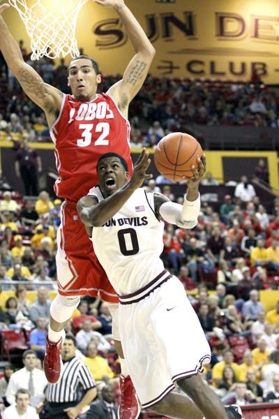 ASU junior guard Carrick Felix goes for a layup against New Mexico senior forward Drew Gordon during the Lobos’ 76-71 win on Friday. Despite Felix’s strong game, the Sun Devils were unable to complete the last-minute comeback. (Photo by Samuel Rosenbaum)
