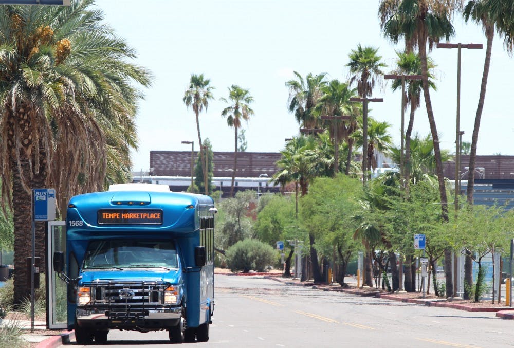 An Orbit shuttle bus stops near lot 59 on the Tempe campus. New Orbit buses that feature a unique design will be implemented before the fall semester starts, according to campus officials. (Photo by Dominic Valente.)