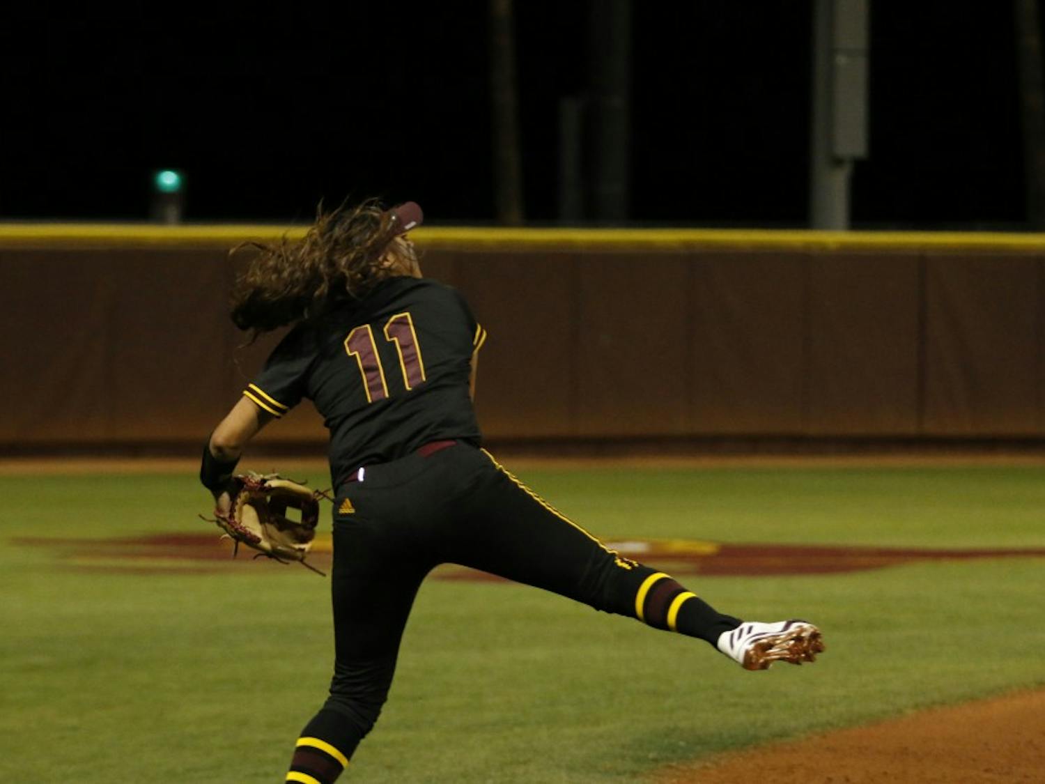 ASU senior short stop Chelsea Gonzales (11) catches the ball and throws it to first base in a softball game versus Oregon State University at Alberta B. Farrington Stadium in Tempe, Arizona on Sunday, March 26, 2017. The Sun Devils won the game 11-0.